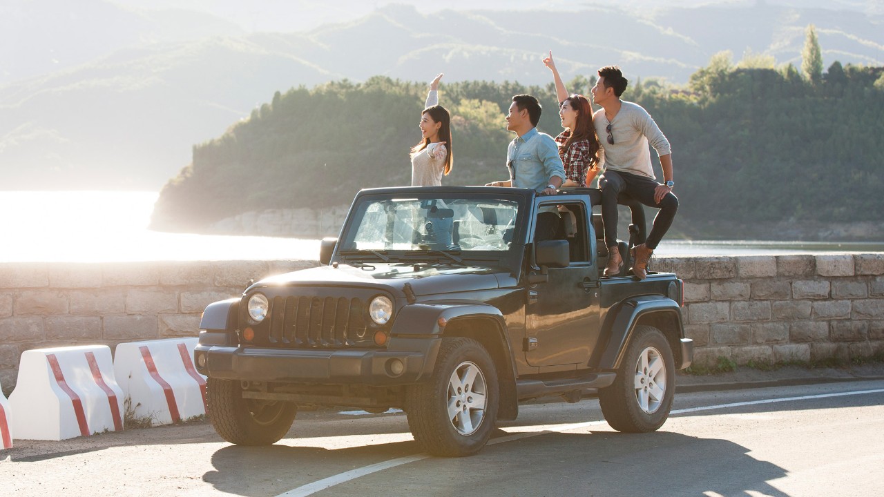 Group of friends enjoying the views on jeeps; image used for HSBC Philippines Loans