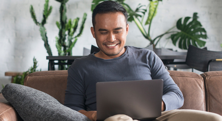 Man using laptop; image used for HSBC Philippines Online Banking