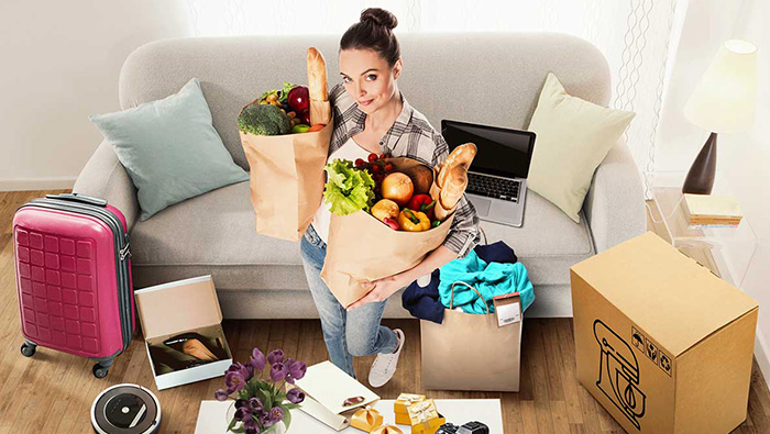 Woman at home with all her shopping; image used for HSBC Philippines Card instalment offers page