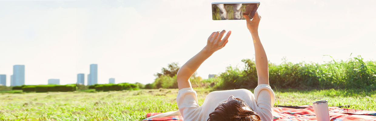 A lady is playing pad on grass, image used for HSBC Update Income - Cash Back Offers