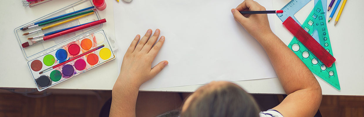 Child drawing at desk; Image used for HSBC Philippines Back to school page