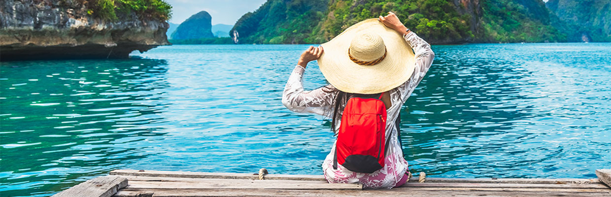A girl is enjoying sea view; image used for HSBC Philippines Rustan's Summer Vibe Promotion