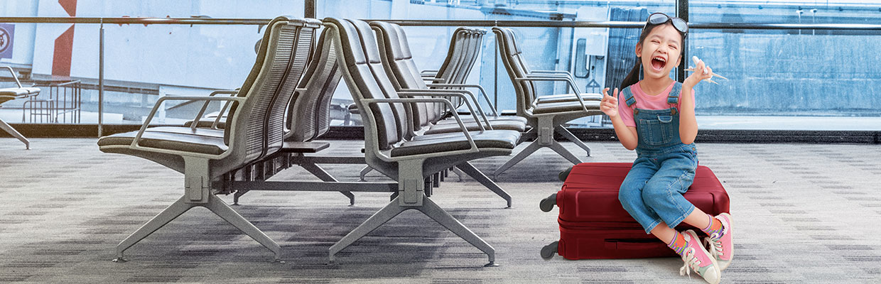 Girl sitting on suitcase outside of airport; image used for HSBC Philippines Credit Card Offers Airlines Seat Sale page