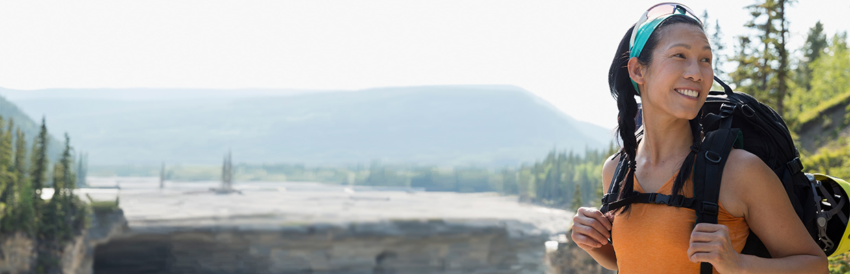 Female backpacker with an adventurous smile; image used for HSBC Philippines Advance Individual Expertise and Support page