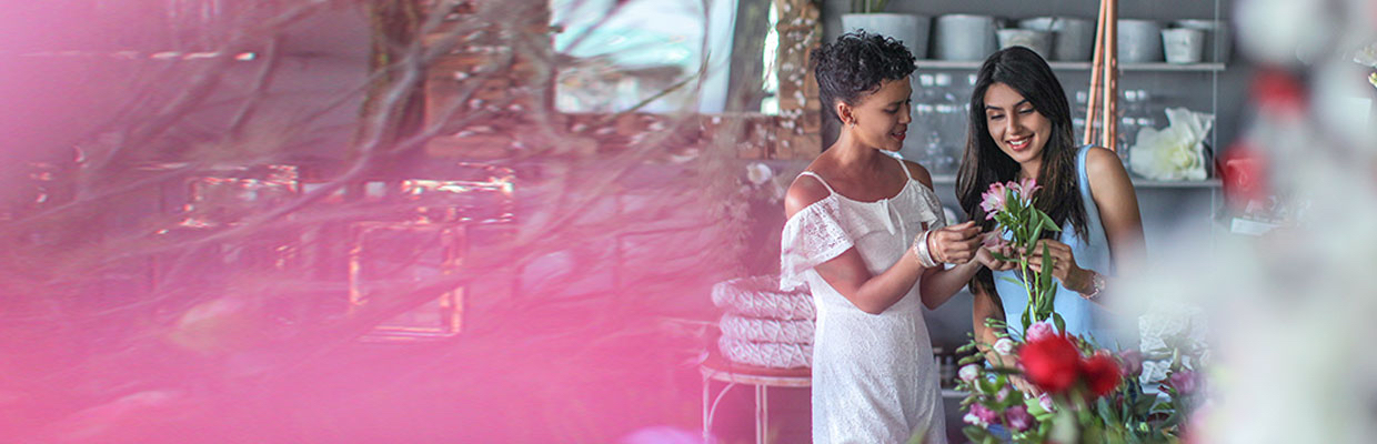 Two girls in a flower shop; Image for ' Credit card rewards' article