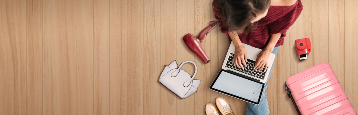 A women is using laptop on the floor; image used for HSBC Philippines get a free FoodPanda voucher promotion page