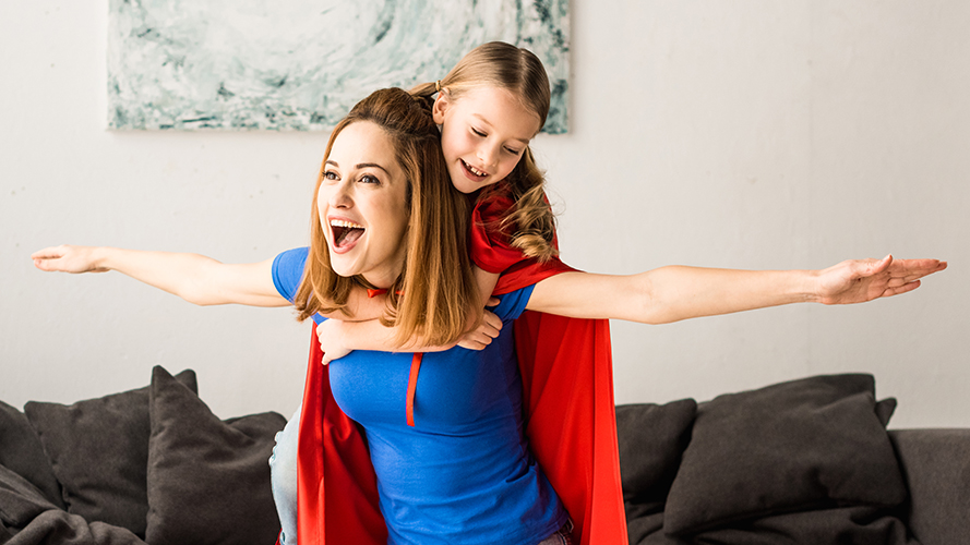 Daughter playing on mother's back; image used for HSBC PH <insert page name here> page