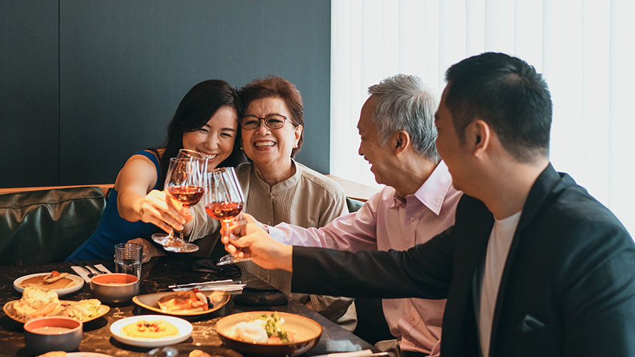Family is holding the glasses up