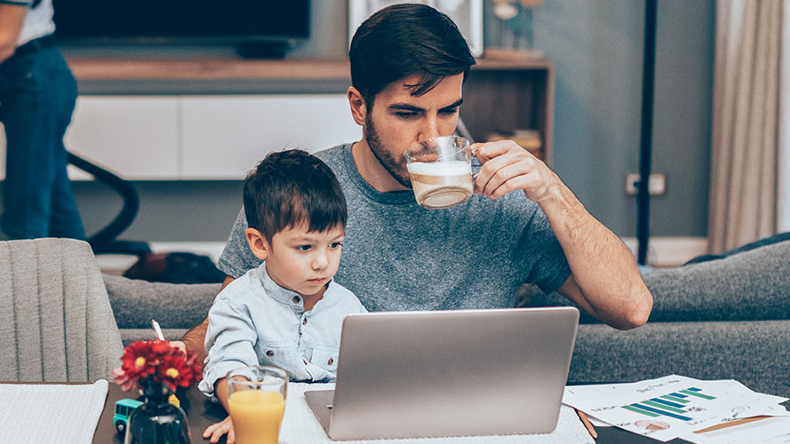 Father and son on computer; image used for HSBC Philippines Cash Rebate page
