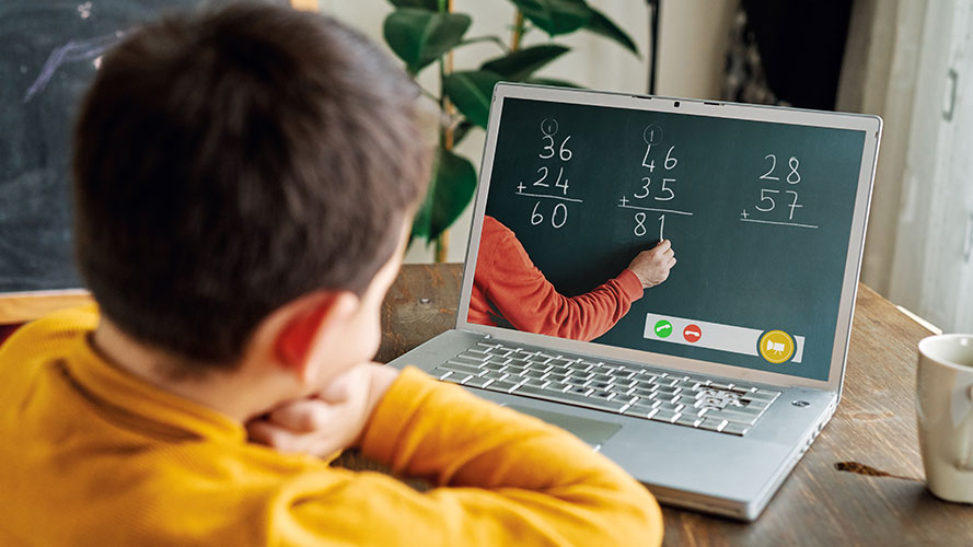 Boy working from home on his computer; image used for HSBC Philippines tuition instalment page