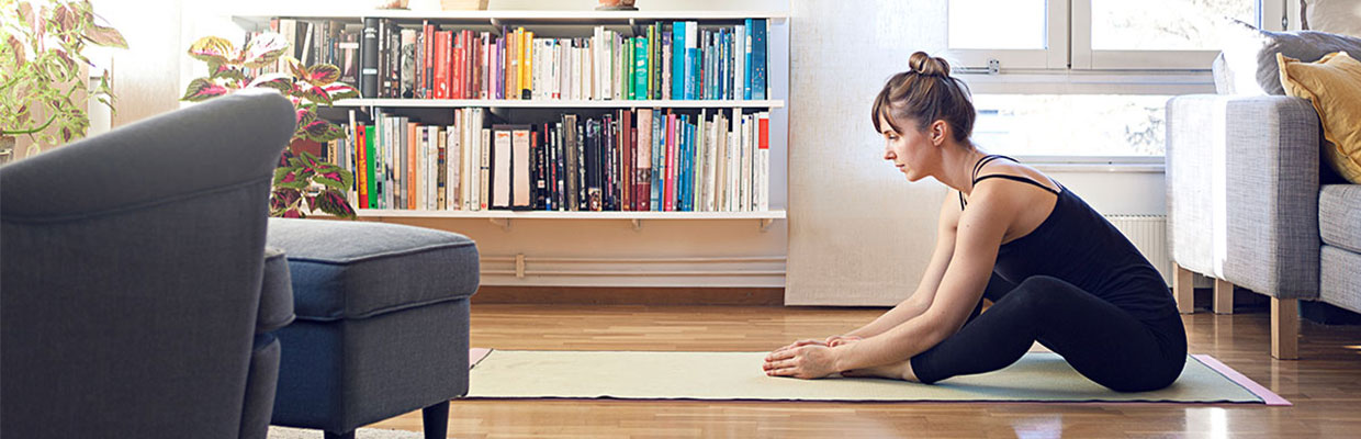 Lady doing yoga at home; image used for the HSBC Philippines Online Entertainment page