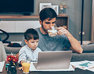 Father drinking coffee and spending time with family