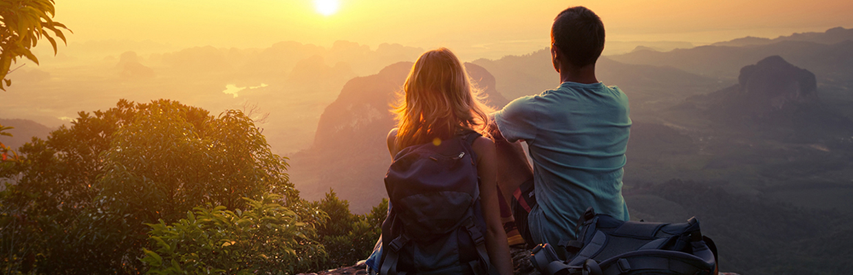 Couple at the top of a mountain at sunset; imaged used for HSBC Philippines Credit Card Premier Offers page