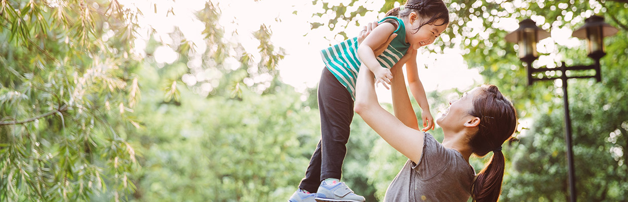 A mother is picking up her daughter for fun; image used for HSBC Mastercard Offers.