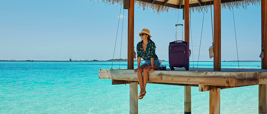 Lady sitting on the end of a dock; image used for HSBC Philippines Red Hot Deals Travel page