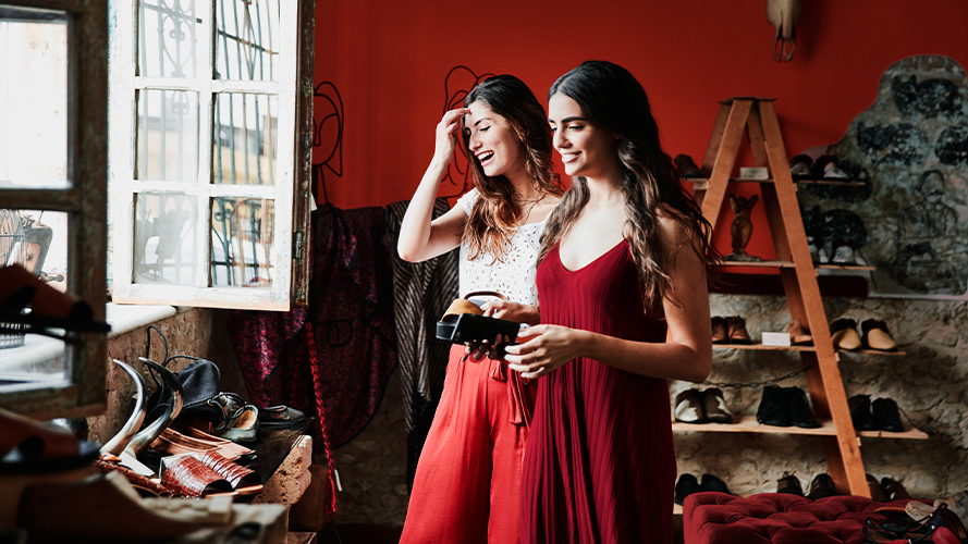 Two women smiling; Image used for HSBC  Global investment opportunities page - Grow your wealth through foreign investments and expand your investment opportunities