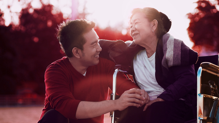 Man hugging his mom; Image used for HSBC Global Banking for Filipinos page - International Bank in the Philippines