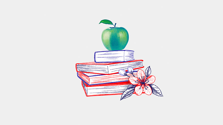 A pile of books with an apple on top