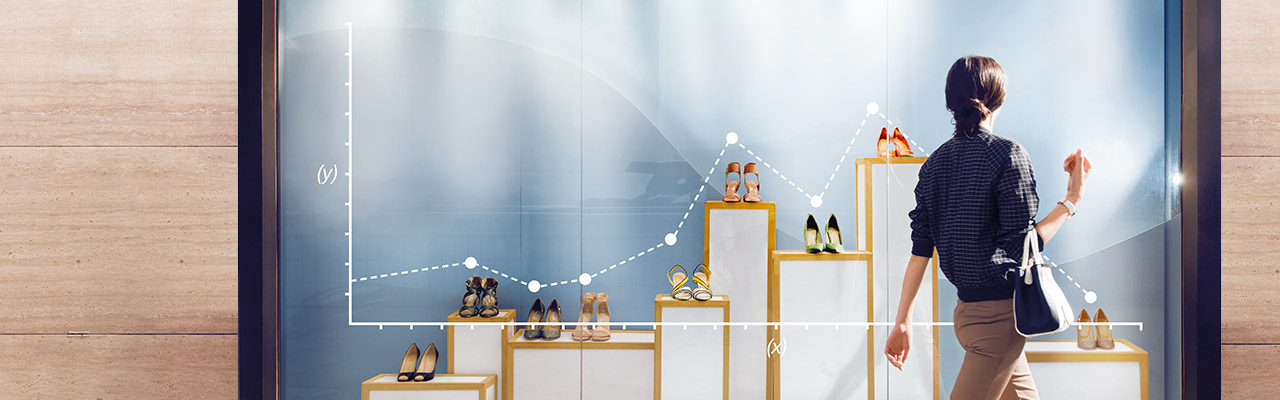 Woman looking at shoes in a shop window; image used for HSBC Premier Mastercard benefits